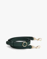 Adjustable strap with metal clasps and a circular buckle detail.