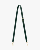 Adjustable bag strap with metal clasps and a circular buckle.