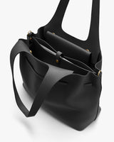 Open handbag with multiple compartments and a shoulder strap.