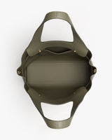 Open handbag viewed from above with two handles and roomy interior.