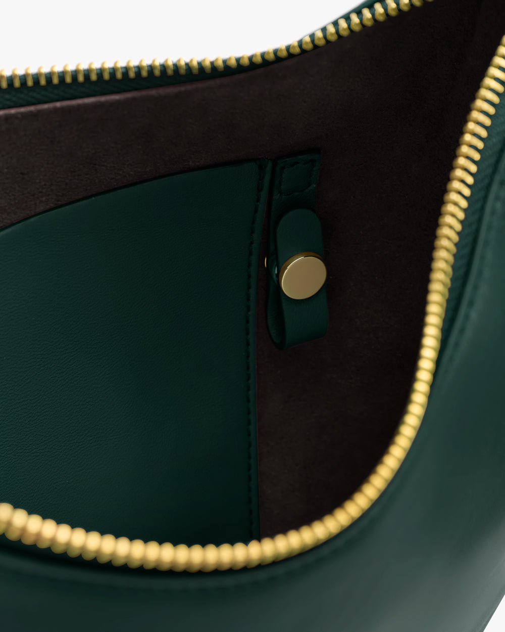 Open bag with visible zipper and buttoned pocket inside.