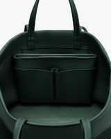 Open travel bag with interior pocket and handles visible.