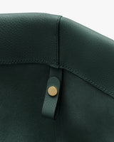 Close-up of tote interior with small loop and button.