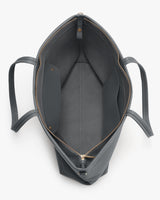 Open handbag with multiple pockets and a zipper closure