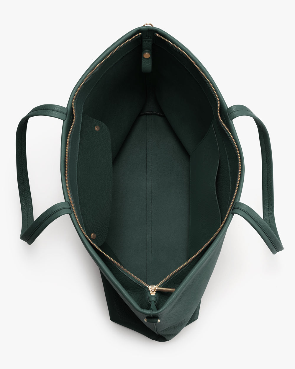 Open top view of a spacious handbag with a zippered edge.