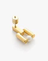 Earring with cylindrical shapes and a small round bead.