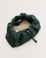 Open bag containing a phone, key, and small pouch.