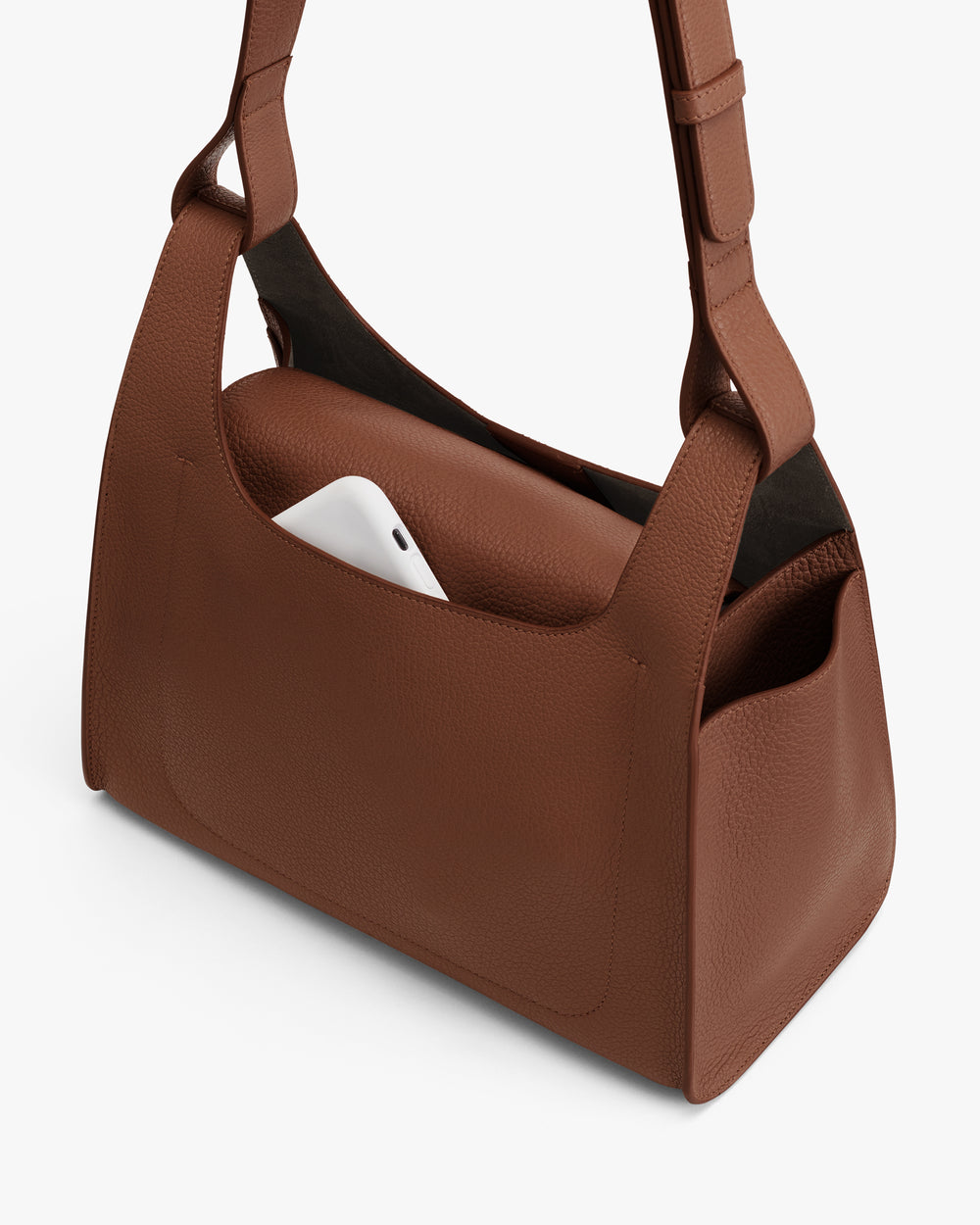 Shoulder bag with a phone peeking out from the side pocket.