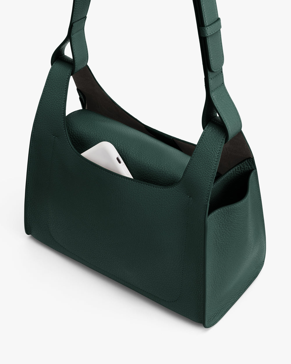 Handbag with a phone in the external pocket.