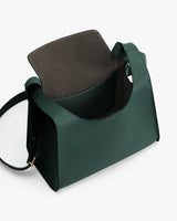 Open handbag with wide strap and visible interior pocket.