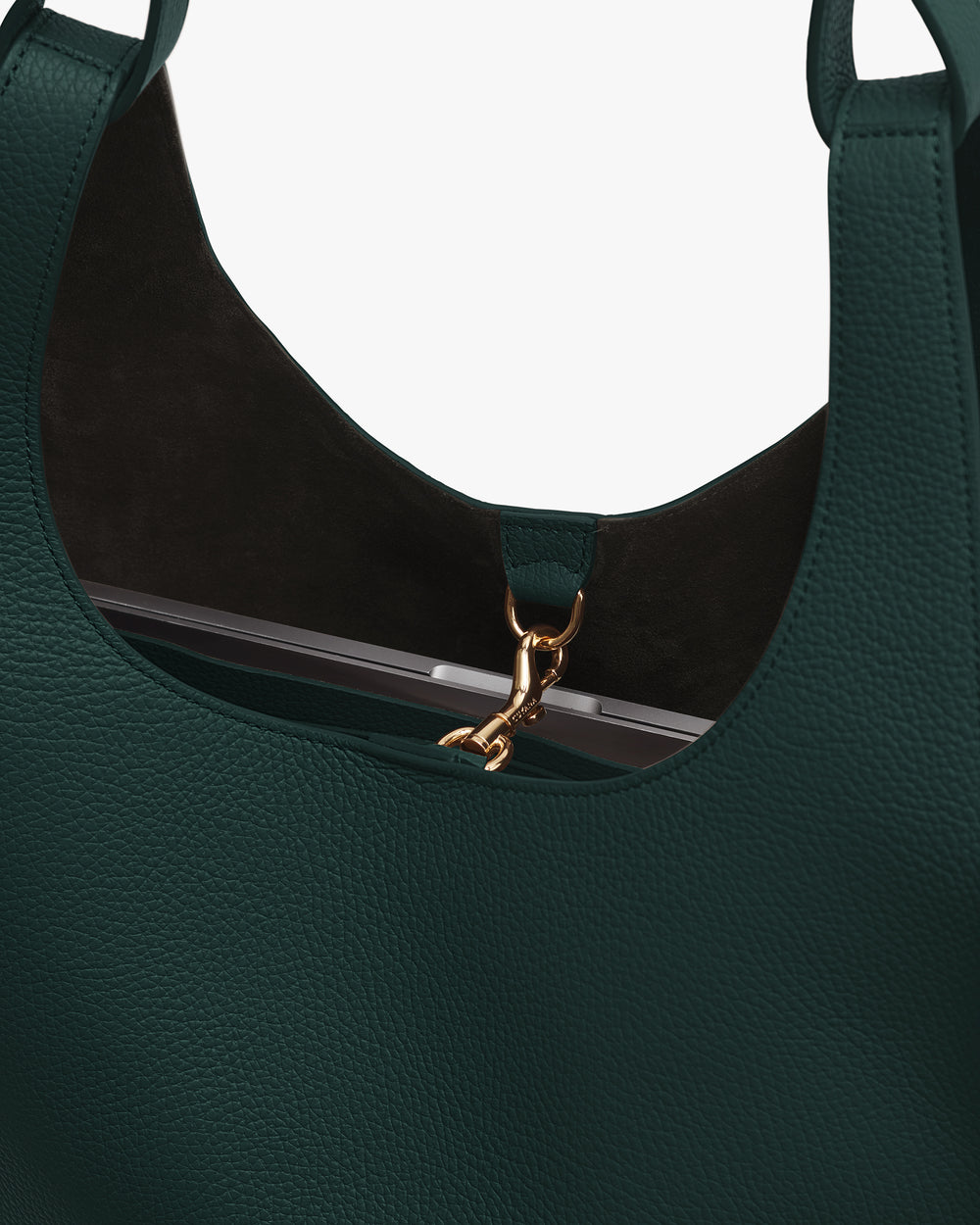 Close-up of a handbag with a clasp and handles visible