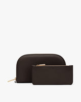 Two zippered leather pouches, one large and one small, on display.
