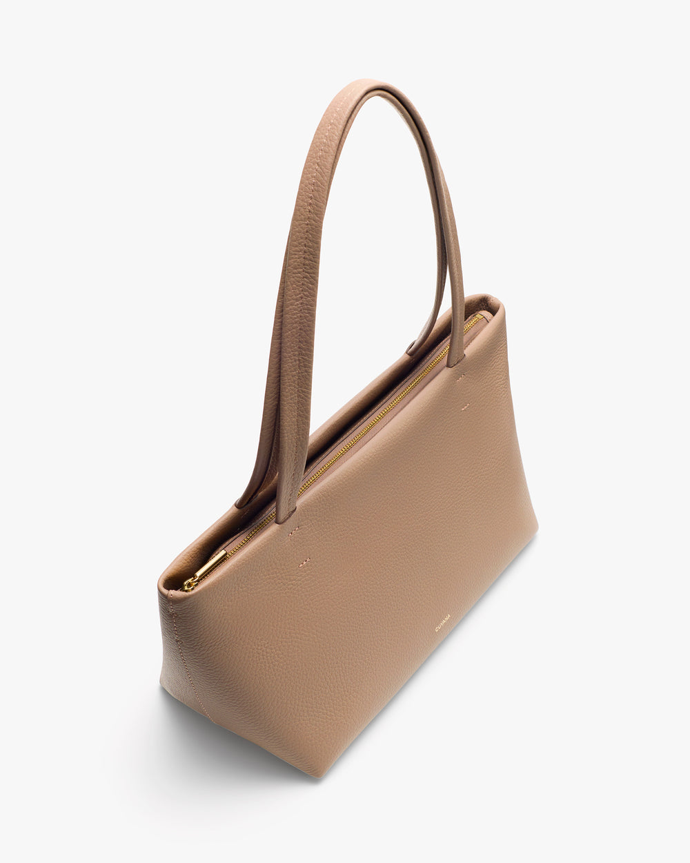 Handbag with long straps and zip closure on top.