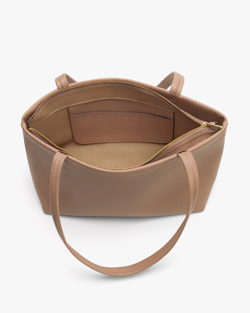 Open handbag with interior pocket and zipper compartment.