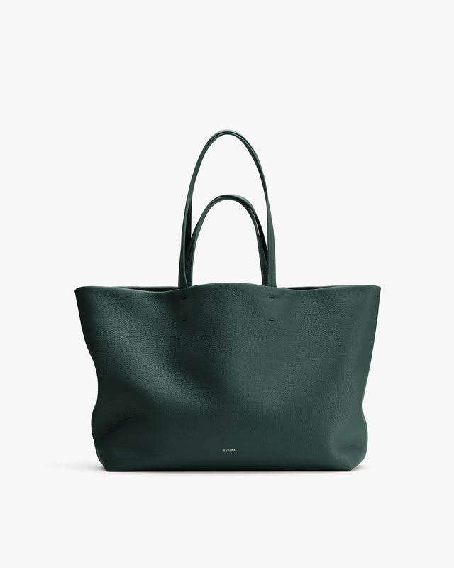 Large tote bag with two handles against plain background.