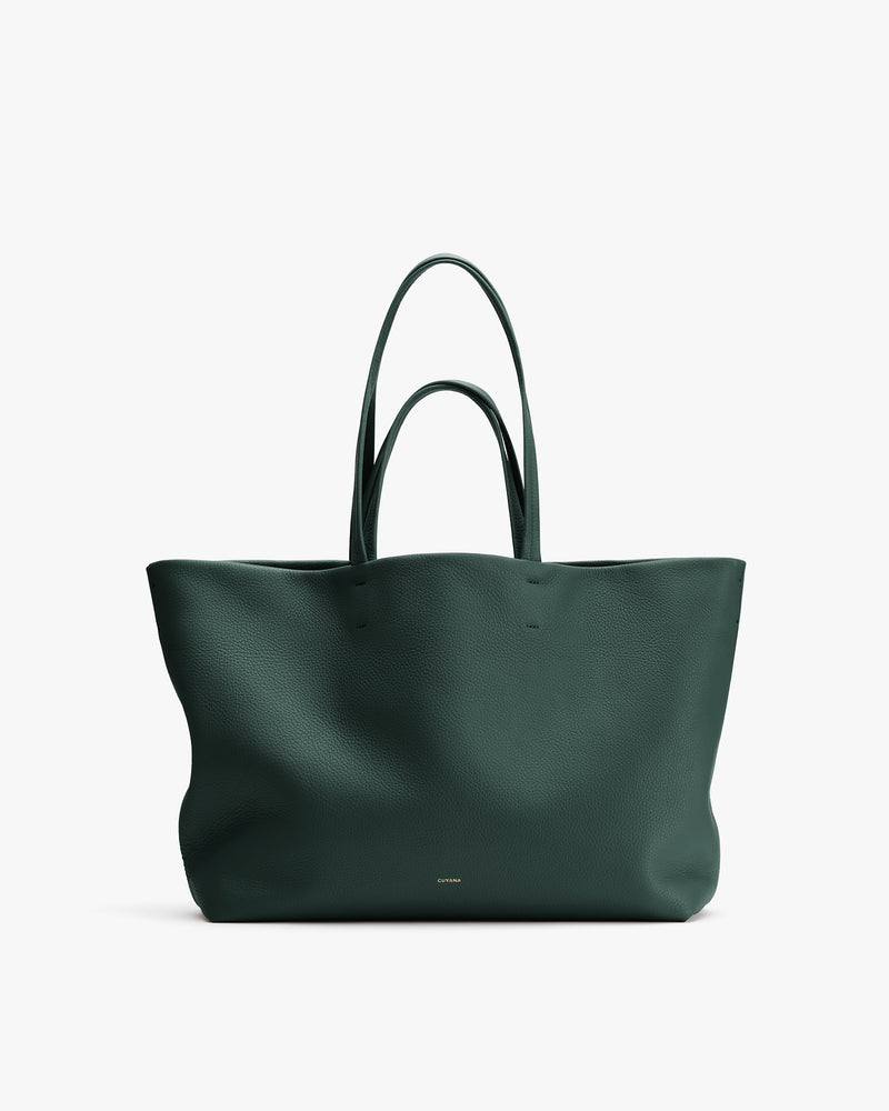 Large tote bag with two handles against plain background.