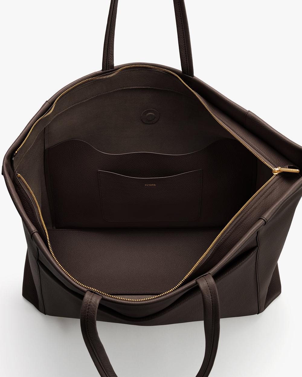 Open travel bag with handles showing interior pocket and lining.