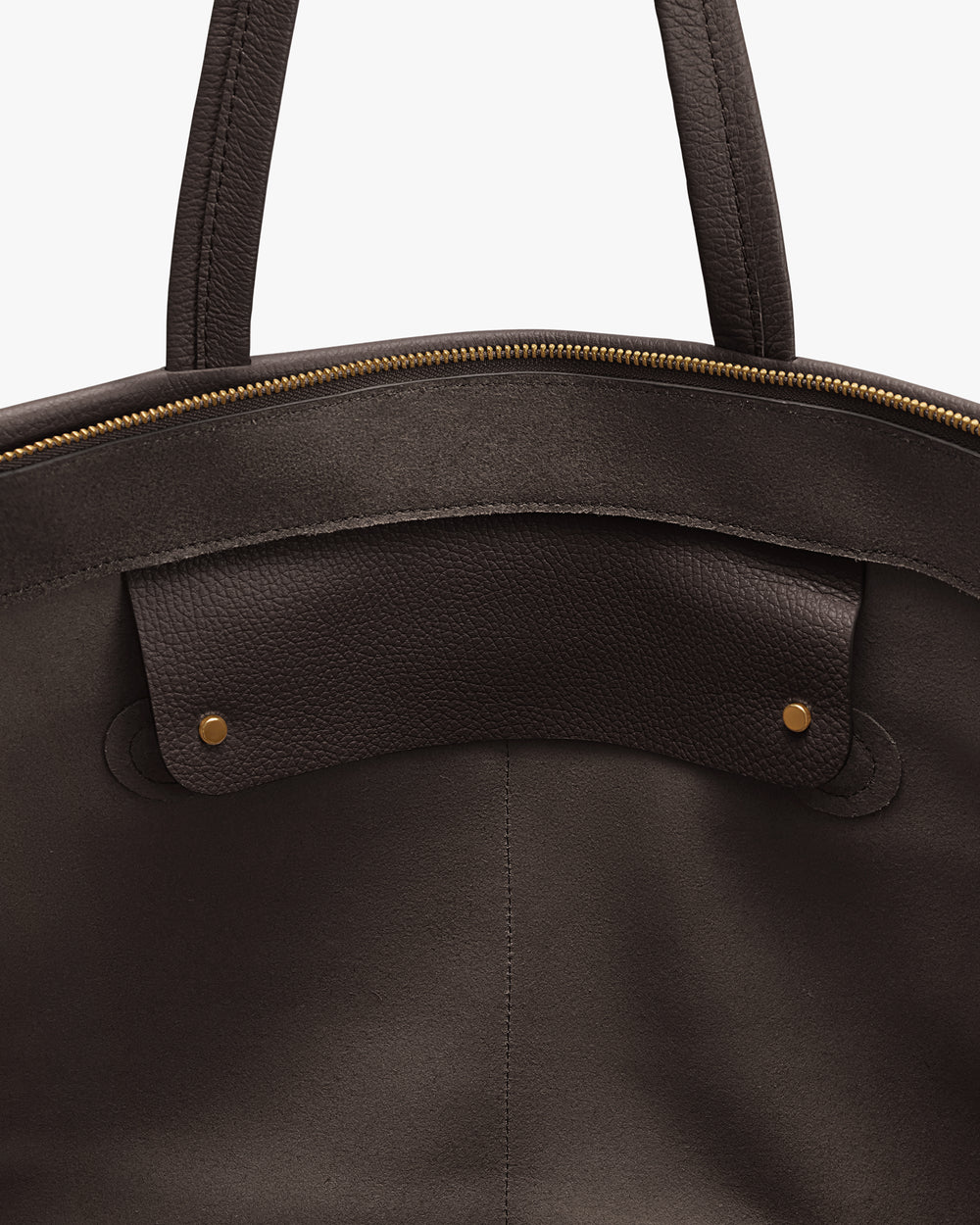 Close-up of an open travel bag with handles and a zippered top.