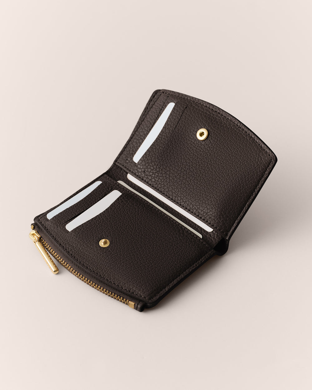 Open wallet with card slots and a zipper pocket.