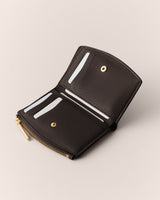 Open wallet with card slots and a zipper pocket.