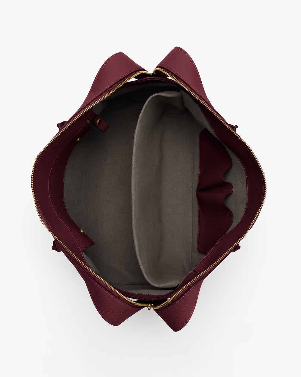 Open travel bag with compartments and zipper closure viewed from above