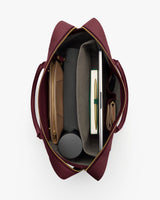 Top view of open travel bag with organized contents inside