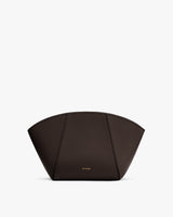 Curved structured handbag with small logo on the front.