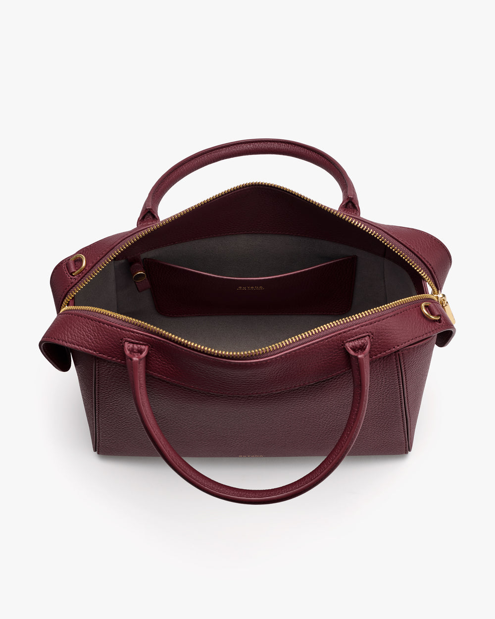 Open handbag with handles and zippered main compartment.