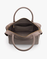 Open handbag with two handles and visible inner pocket
