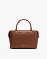 Handbag with top handles and zipper closure.
