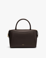 Handbag with top handle and zipper closure on white background.