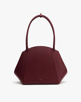Hexagonal handbag with two handles.