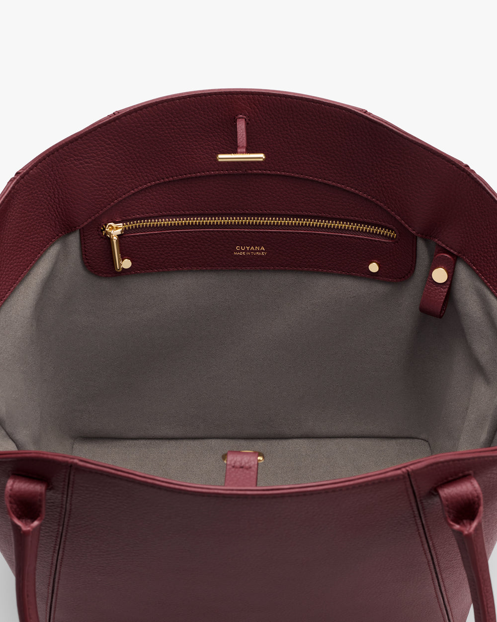 Open tote bag with interior pocket and zipper compartment.