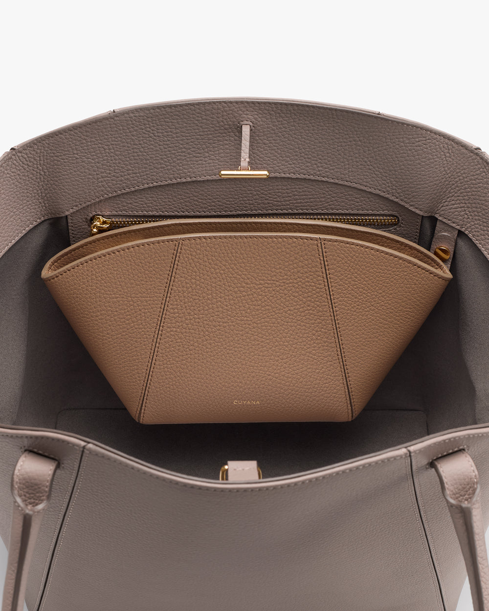Open handbag showing an inner zippered pouch