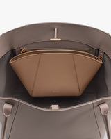 Open handbag showing an inner zippered pouch