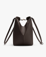 Structured handbag with a top handle and adjustable straps.