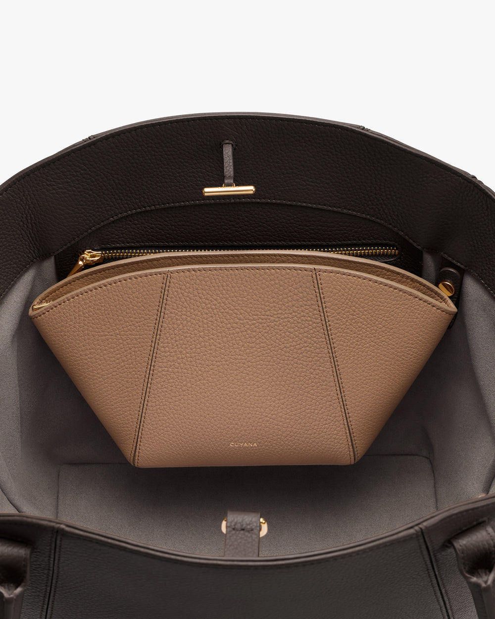 Open handbag with zippered pouch inside.