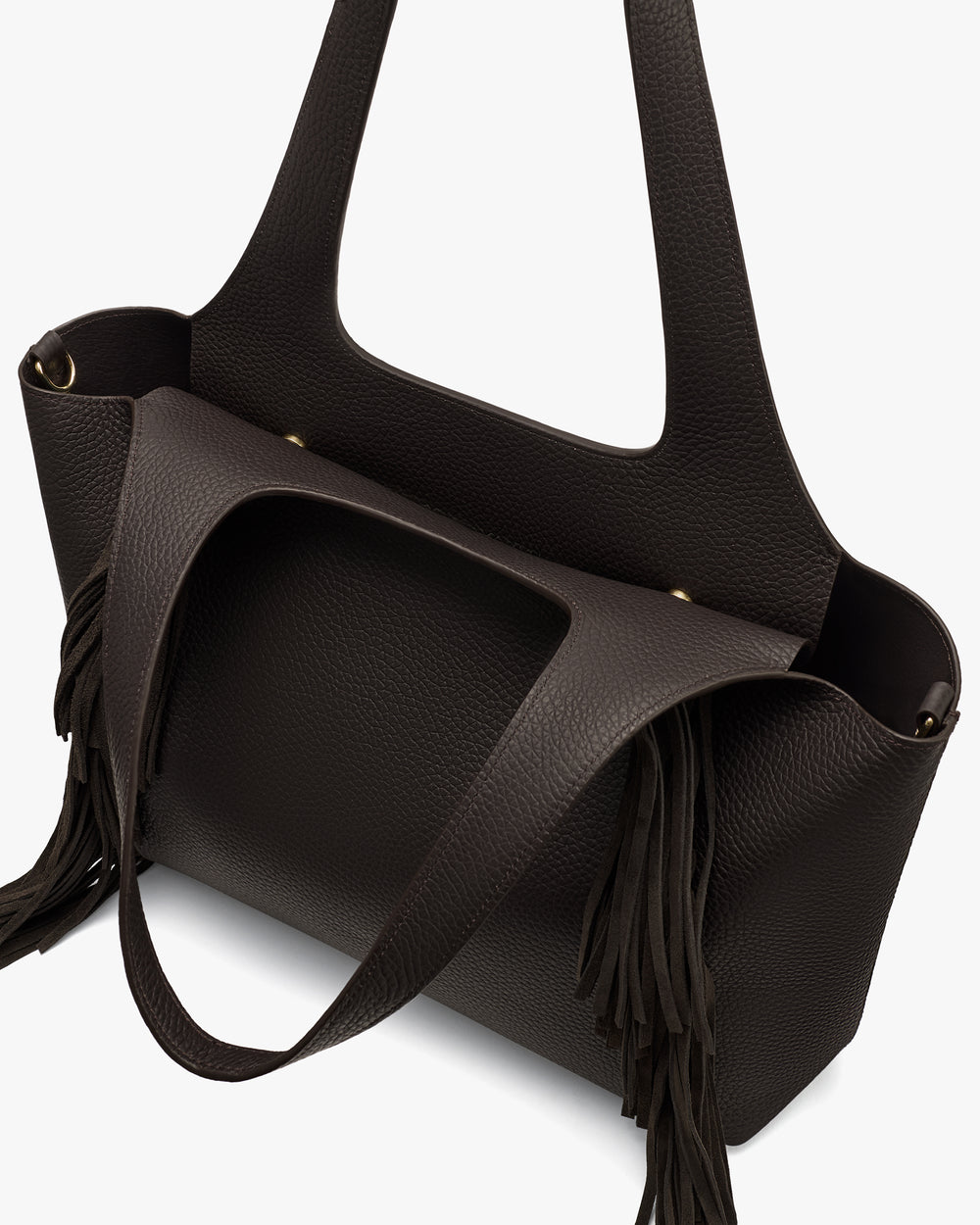 Tote bag with fringe details and wide handles in a textured material.