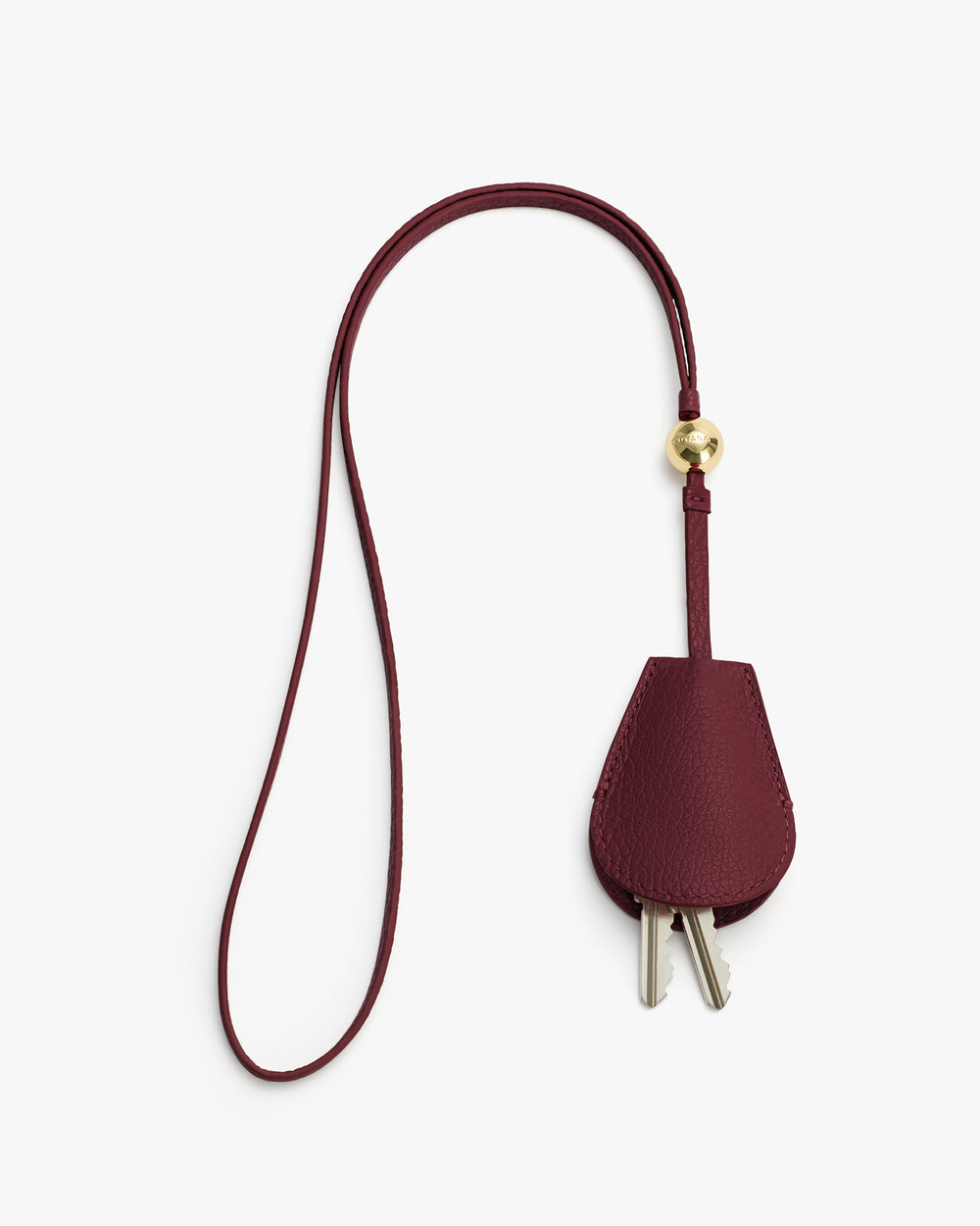Leather key holder with a long strap and a gold bead detail.