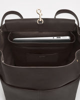 Open bag with laptop inside and a small clasp at the top.