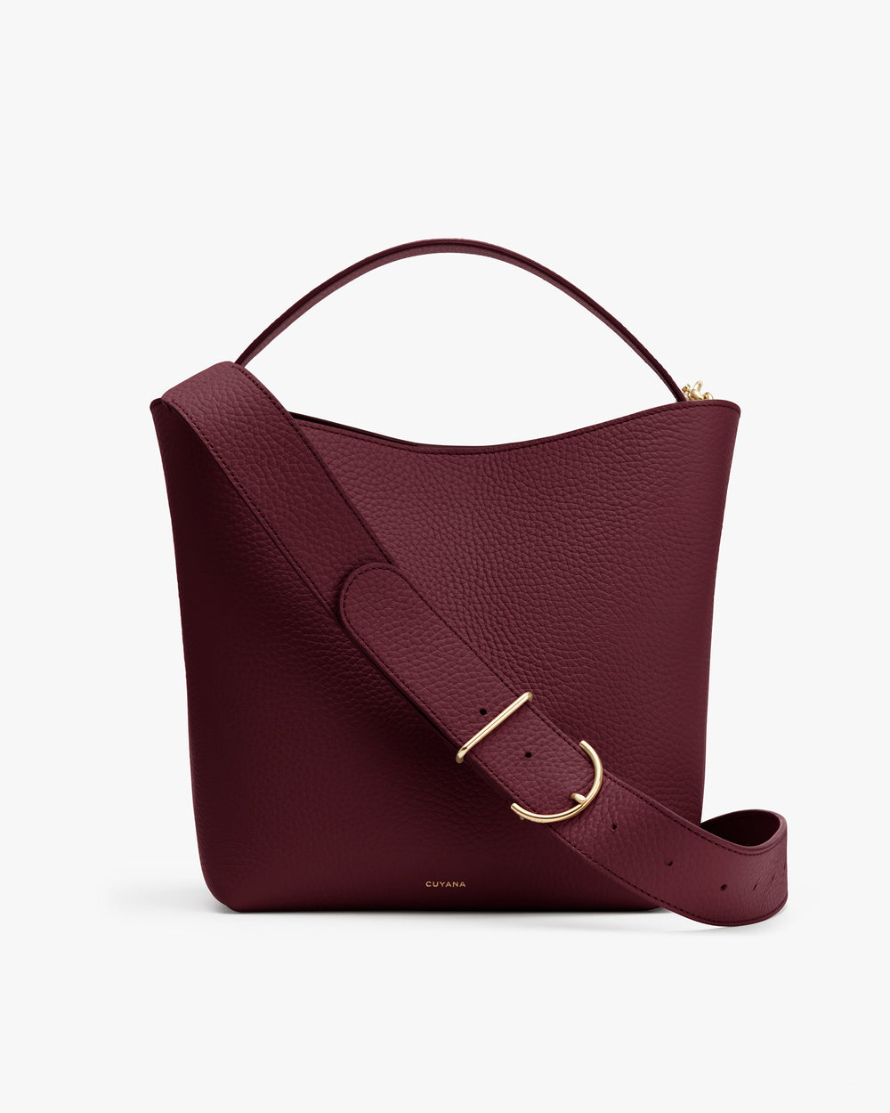 A handbag with a wide shoulder strap and handle.