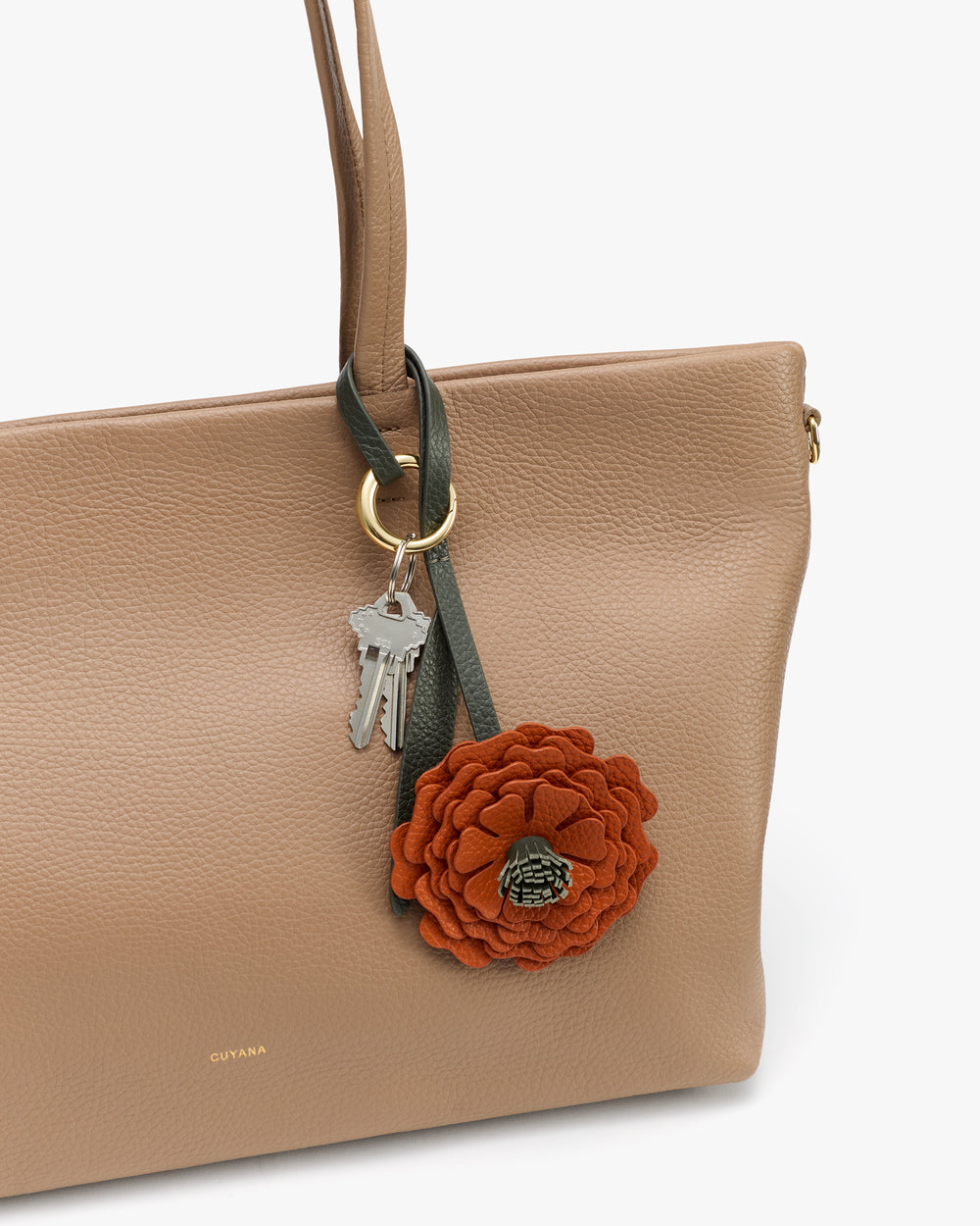 Handbag with flower keychain and keys attached