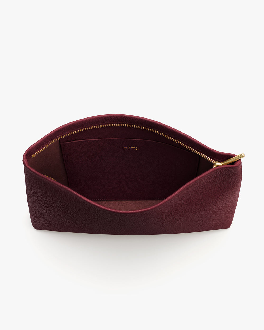 Open travel bag with a zipper and interior pocket.