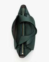 Top view of an open travel bag with visible zippers.