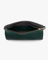 Open zippered travel bag showing interior pocket.
