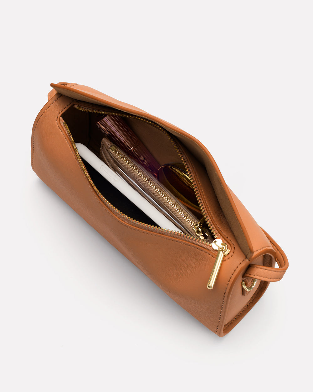 Open pouch with zipper showing contents like wallet and notebooks.