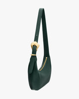 Shoulder bag with a long strap and zipper closure.