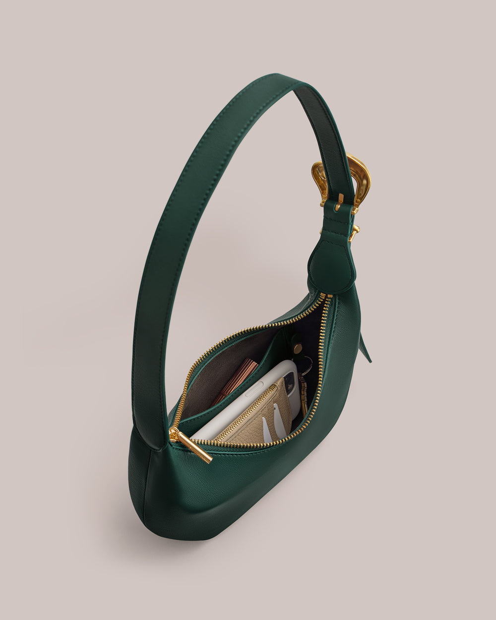 Handbag with an open zipper showcasing its contents, including a wallet and a smartphone.