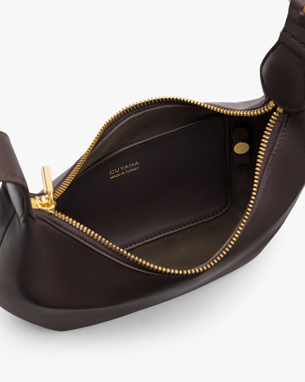 Open handbag with visible zipper and interior compartment.