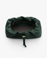 Open drawstring bag with visible interior pocket and gold accents.